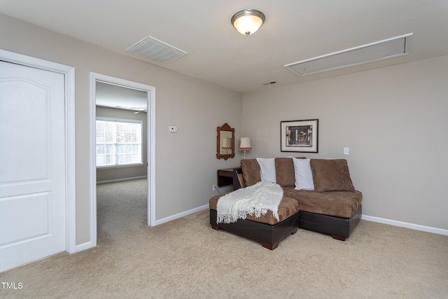 carpeted bedroom featuring baseboards, visible vents, and attic access