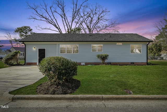 view of front of house featuring crawl space, a yard, concrete driveway, and a shingled roof