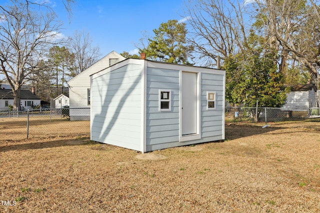 view of shed with a fenced backyard