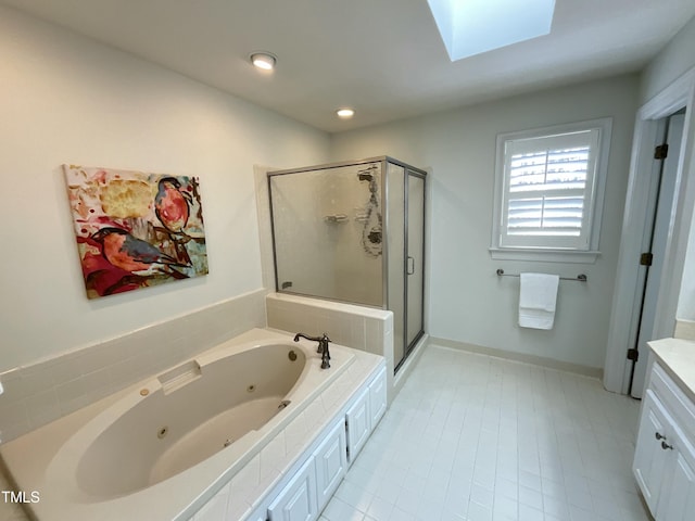 full bath featuring vanity, a skylight, recessed lighting, a shower stall, and a jetted tub