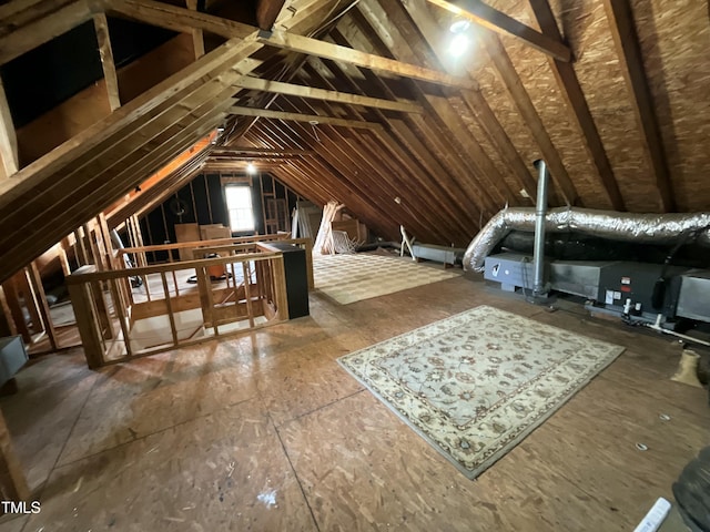 unfinished attic featuring an upstairs landing