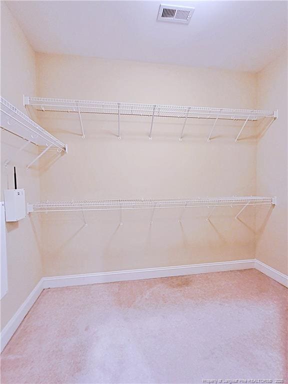 walk in closet with visible vents