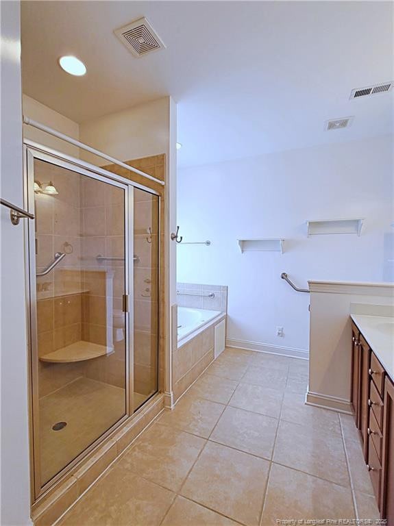 bathroom with a garden tub, a shower stall, visible vents, and tile patterned floors