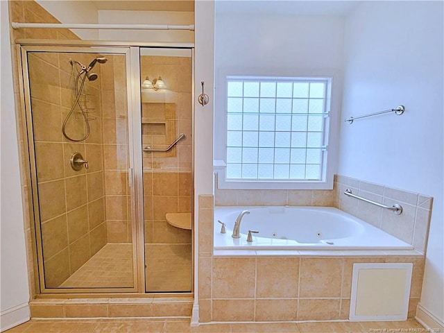 full bath featuring a shower stall and a whirlpool tub