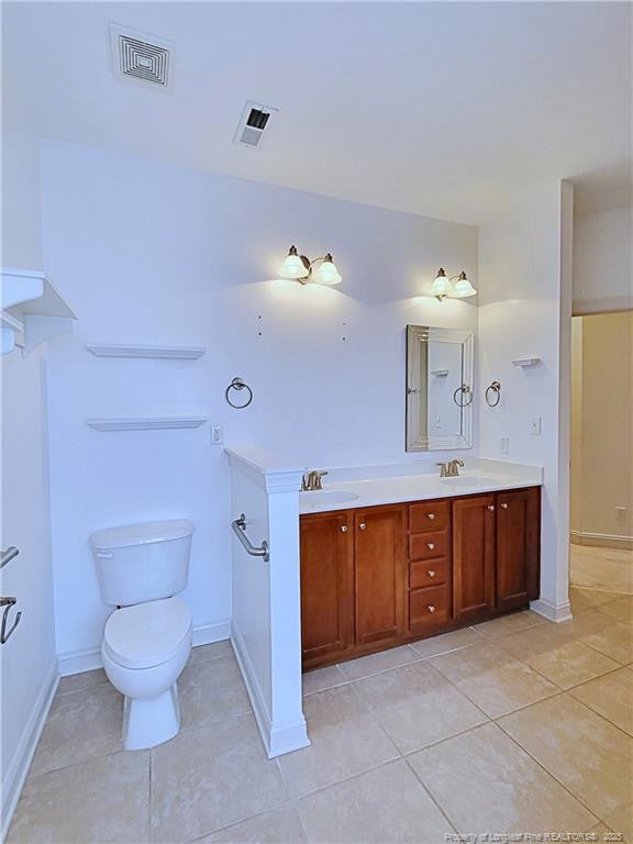 full bath featuring tile patterned flooring, visible vents, a sink, and toilet