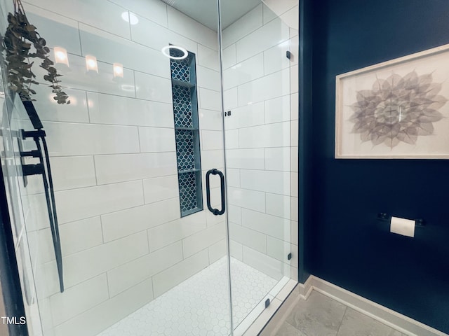 4271 Millet St SW, Concord, NC 28027 - bathroom with a stall shower, baseboards, and tile patterned flooring