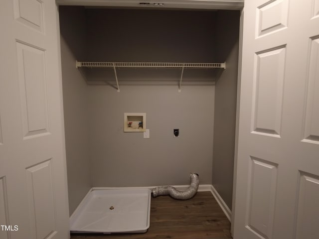 laundry area featuring baseboards, laundry area, dark wood-style flooring, electric dryer hookup, and washer hookup