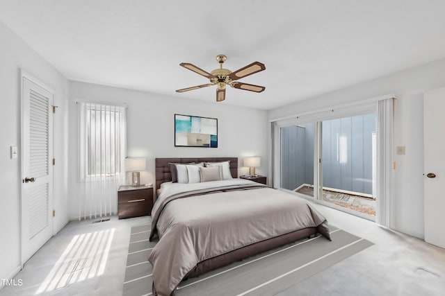 bedroom featuring light colored carpet, a ceiling fan, and access to outside