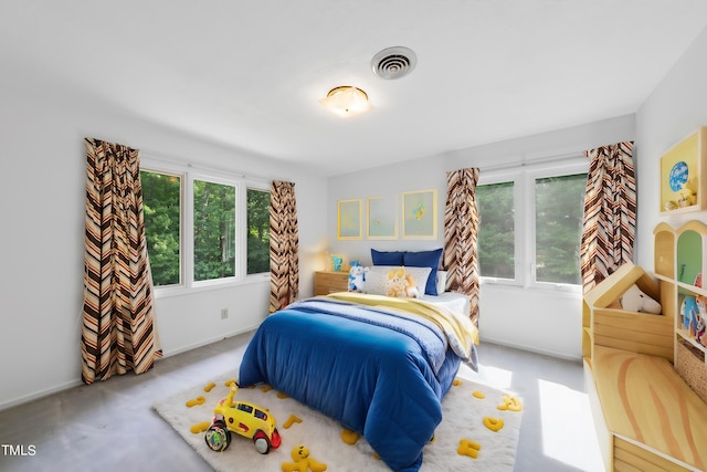 bedroom featuring visible vents, baseboards, and carpet flooring