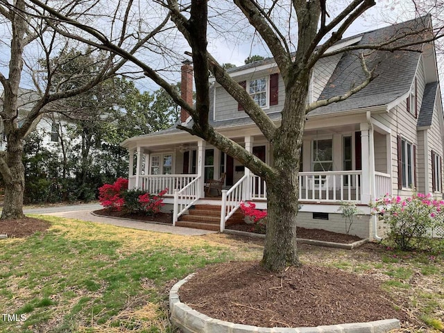 view of front of home with crawl space, covered porch, a chimney, and a shingled roof