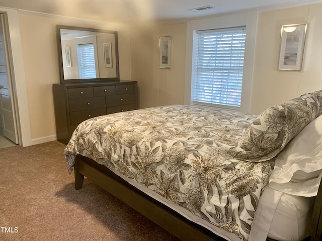 bedroom featuring visible vents, baseboards, and carpet flooring