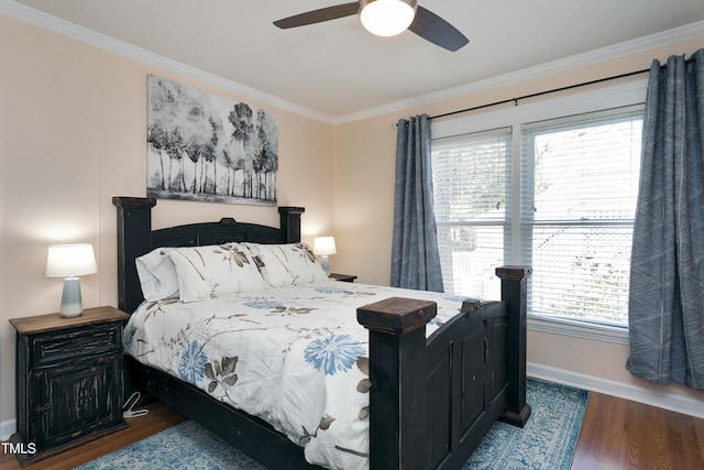 bedroom featuring ceiling fan, wood finished floors, baseboards, and ornamental molding