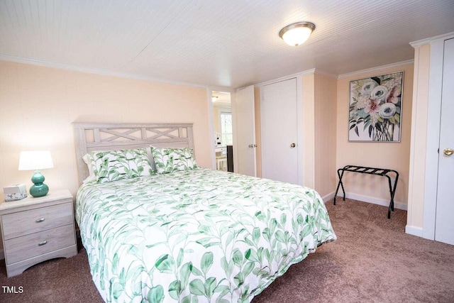 carpeted bedroom featuring baseboards and ornamental molding