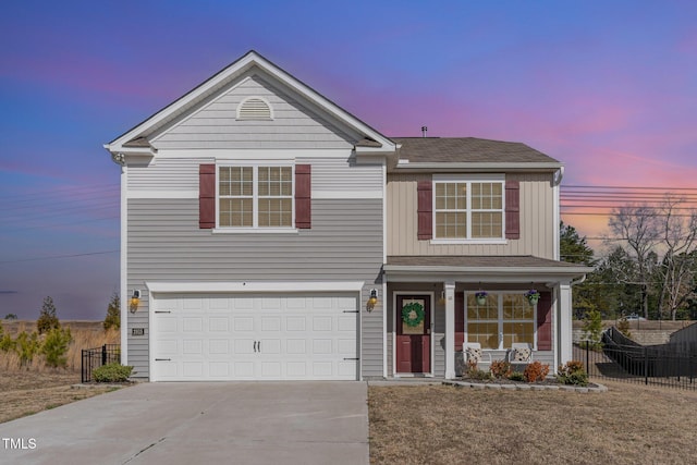 traditional-style house featuring a porch, fence, driveway, and board and batten siding