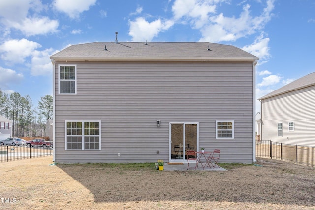 back of property with a patio area and a fenced backyard