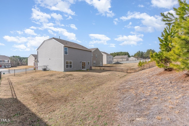 exterior space with a fenced backyard and central AC