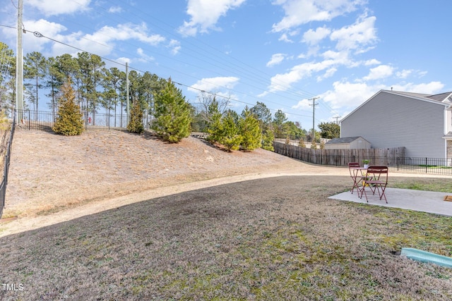 view of yard featuring a patio area and fence