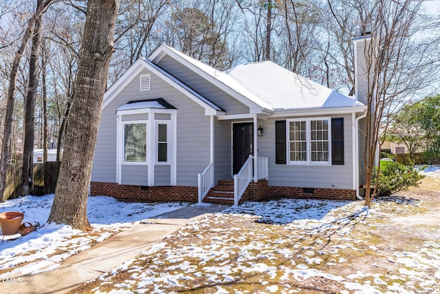 single story home with crawl space, a shingled roof, and a chimney