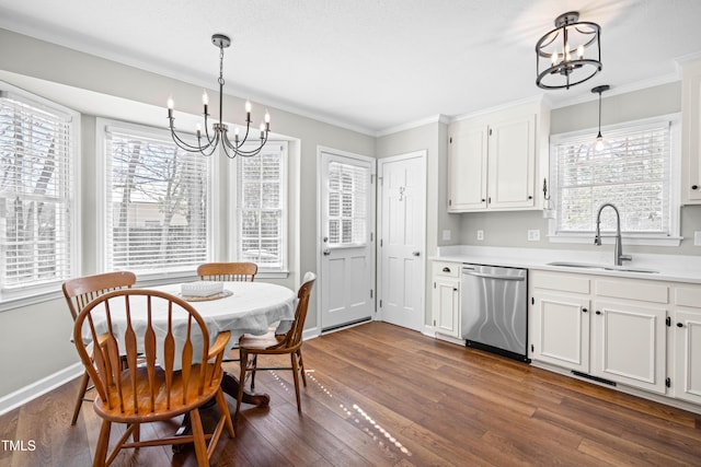 dining room with dark wood-style floors, a notable chandelier, and plenty of natural light