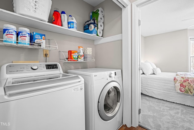 clothes washing area with laundry area and separate washer and dryer