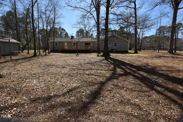 view of yard featuring a wooden deck