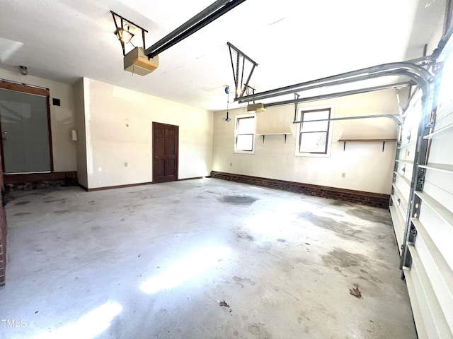 garage featuring baseboards and a garage door opener