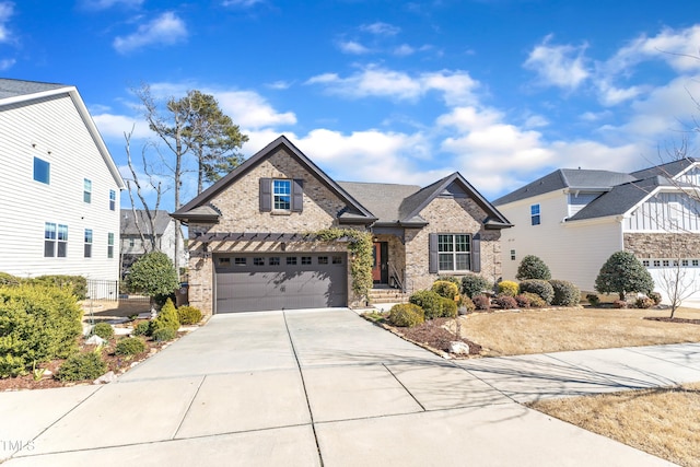 view of front of home featuring brick siding, driveway, and an attached garage