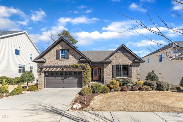 view of front of home with a garage, concrete driveway, and brick siding