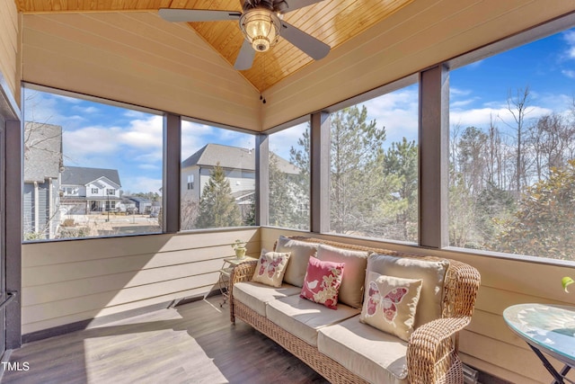 sunroom / solarium featuring vaulted ceiling and a ceiling fan