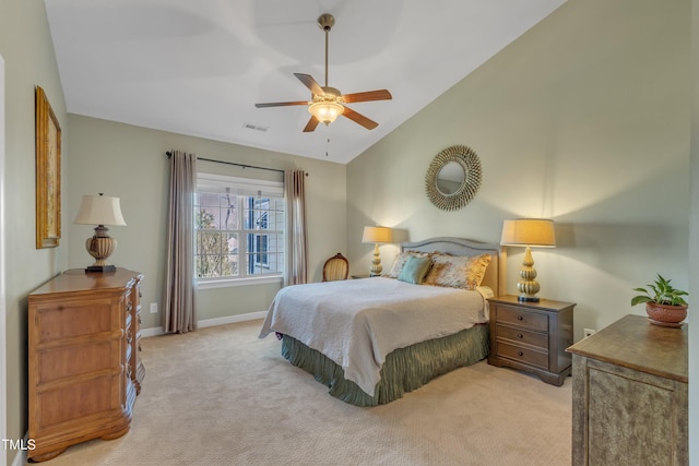 carpeted bedroom featuring a ceiling fan, visible vents, vaulted ceiling, and baseboards