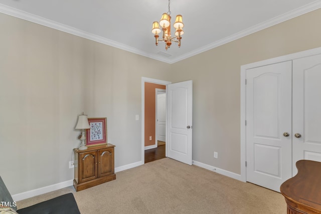 interior space featuring baseboards, a chandelier, and crown molding