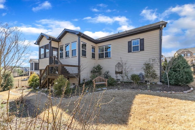 exterior space featuring crawl space, fence, and stairs