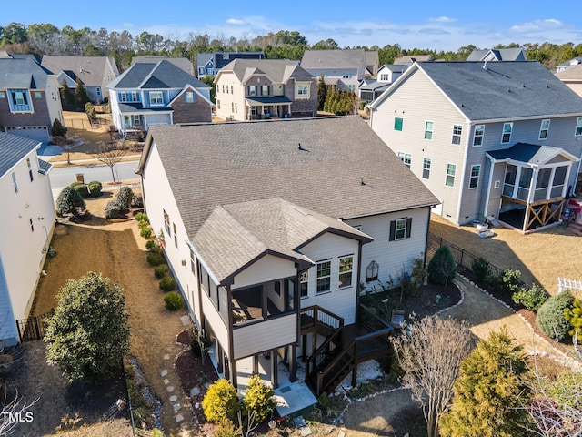 birds eye view of property with a residential view