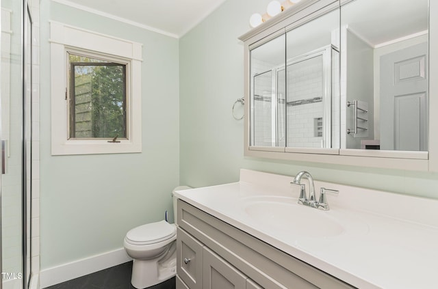 bathroom with toilet, baseboards, a tile shower, and vanity