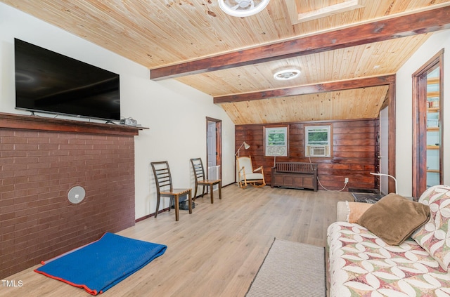 living room featuring wooden walls, wooden ceiling, beamed ceiling, and light wood-style flooring