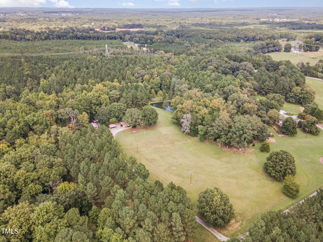 bird's eye view featuring a wooded view