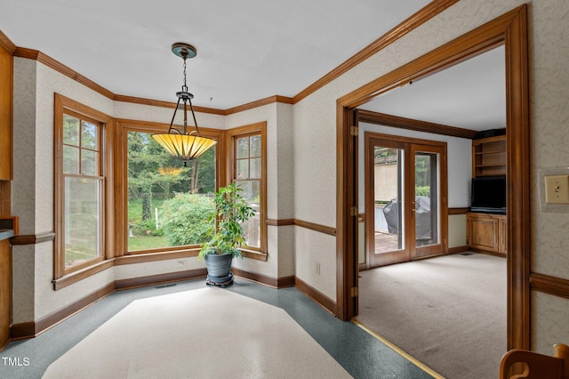 carpeted dining room with baseboards, visible vents, ornamental molding, and french doors