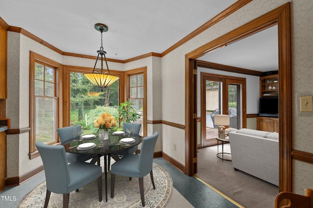 dining room featuring wallpapered walls, baseboards, and crown molding