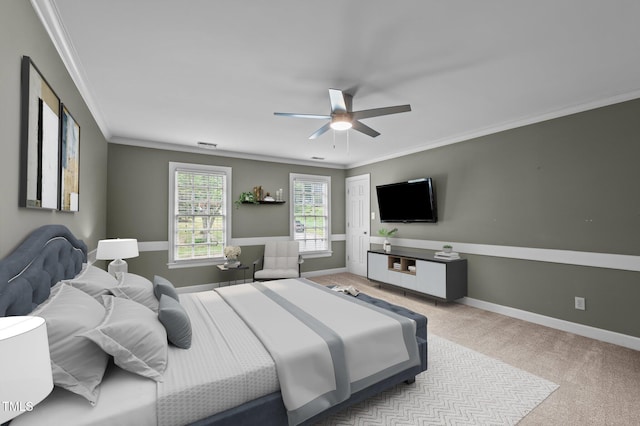 bedroom featuring baseboards, carpet, a ceiling fan, and crown molding