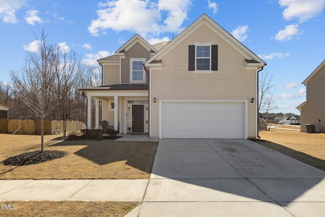 view of front of house with central AC unit, concrete driveway, an attached garage, fence, and board and batten siding