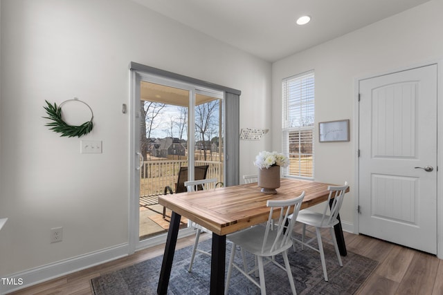 dining room with recessed lighting, baseboards, and wood finished floors