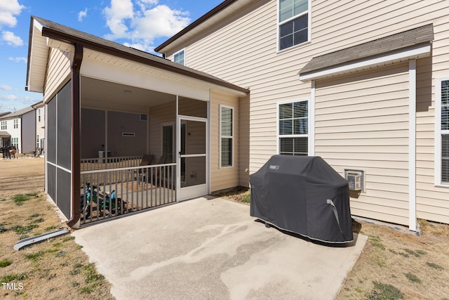 view of patio / terrace with area for grilling and a sunroom