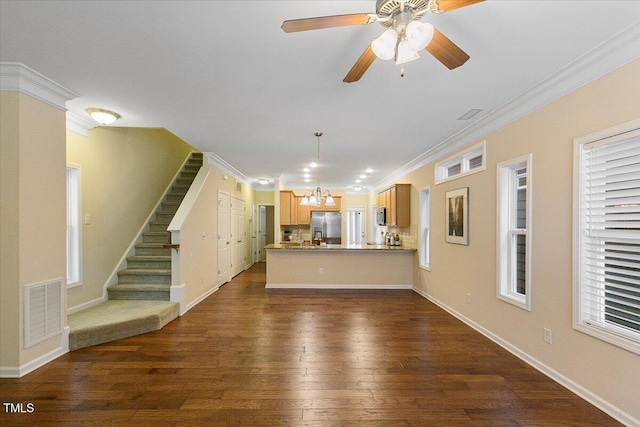 unfurnished living room with ornamental molding, visible vents, dark wood finished floors, and stairway