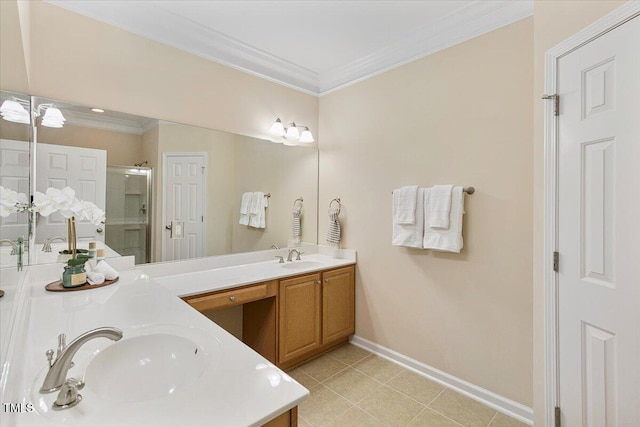 bathroom with ornamental molding, a sink, and a shower stall