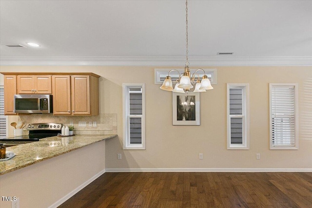 kitchen featuring pendant lighting, dark wood finished floors, stainless steel appliances, decorative backsplash, and ornamental molding