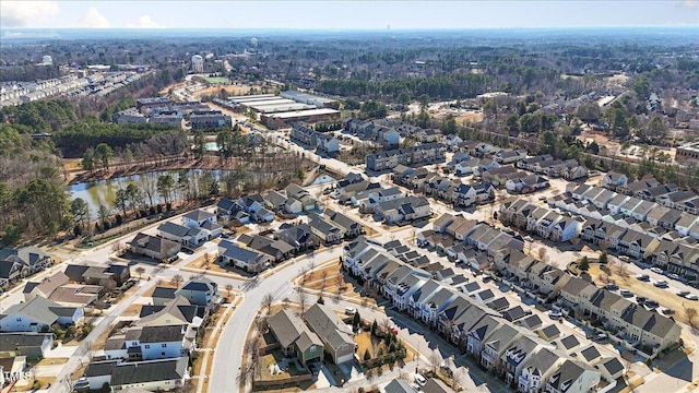 bird's eye view featuring a residential view and a water view