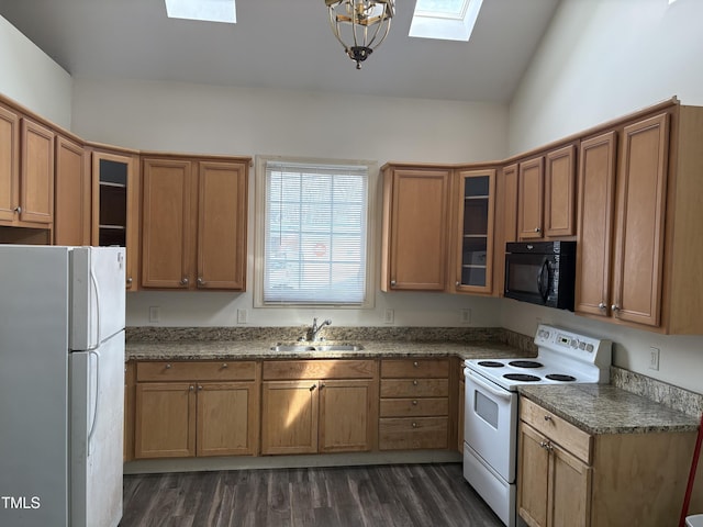 kitchen featuring white appliances, dark wood-style floors, brown cabinetry, and a sink