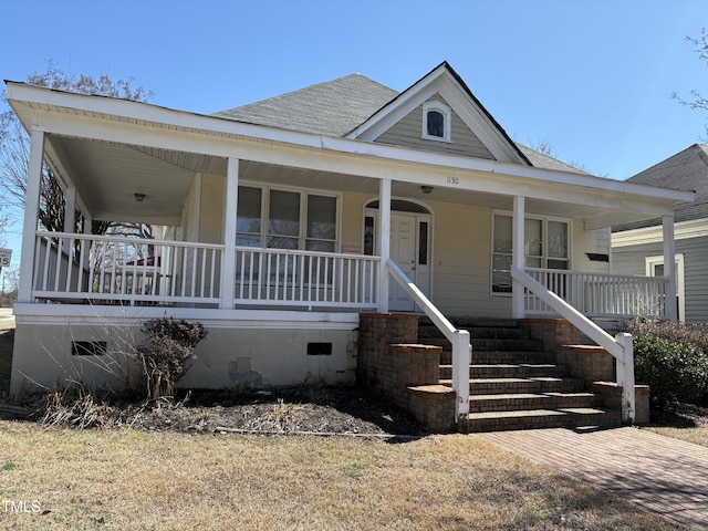 view of front of home featuring covered porch, a shingled roof, and crawl space