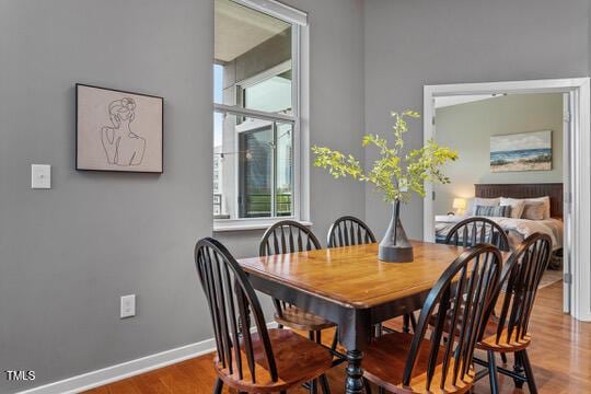 dining room with wood finished floors and baseboards