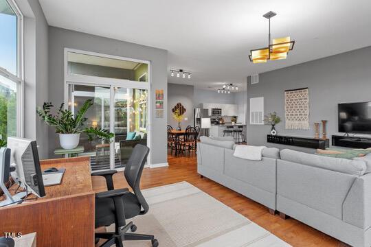 living room featuring a healthy amount of sunlight and wood finished floors